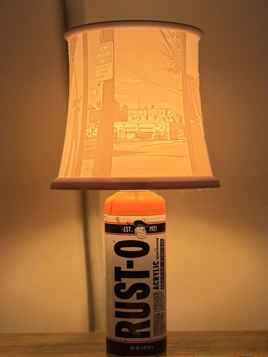 Rust-Oleum can lamp with a 3D-printed lithophane shade showing a graffiti-covered building